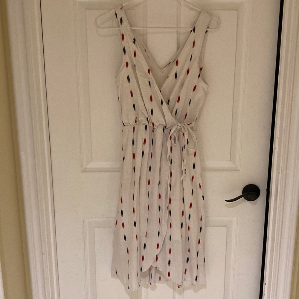 White wrap dress with blue and red design